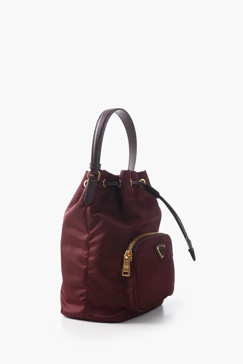 PRADA Duet Re-Nylon Enameled Triangle Logo Bucket Bag in Burgundy 1