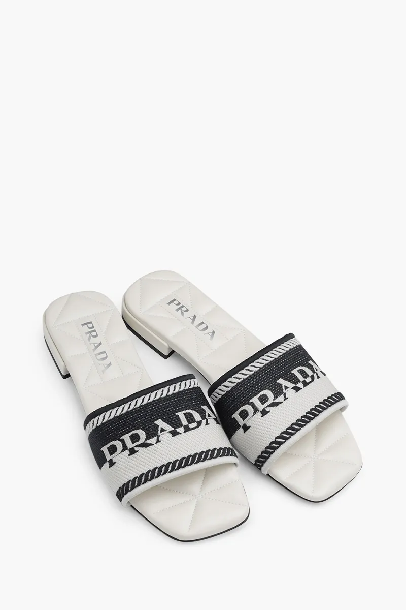 PRADA Women Embroidered Lettering Logo Slides in Black/Chalk White with Quilted Sole 1