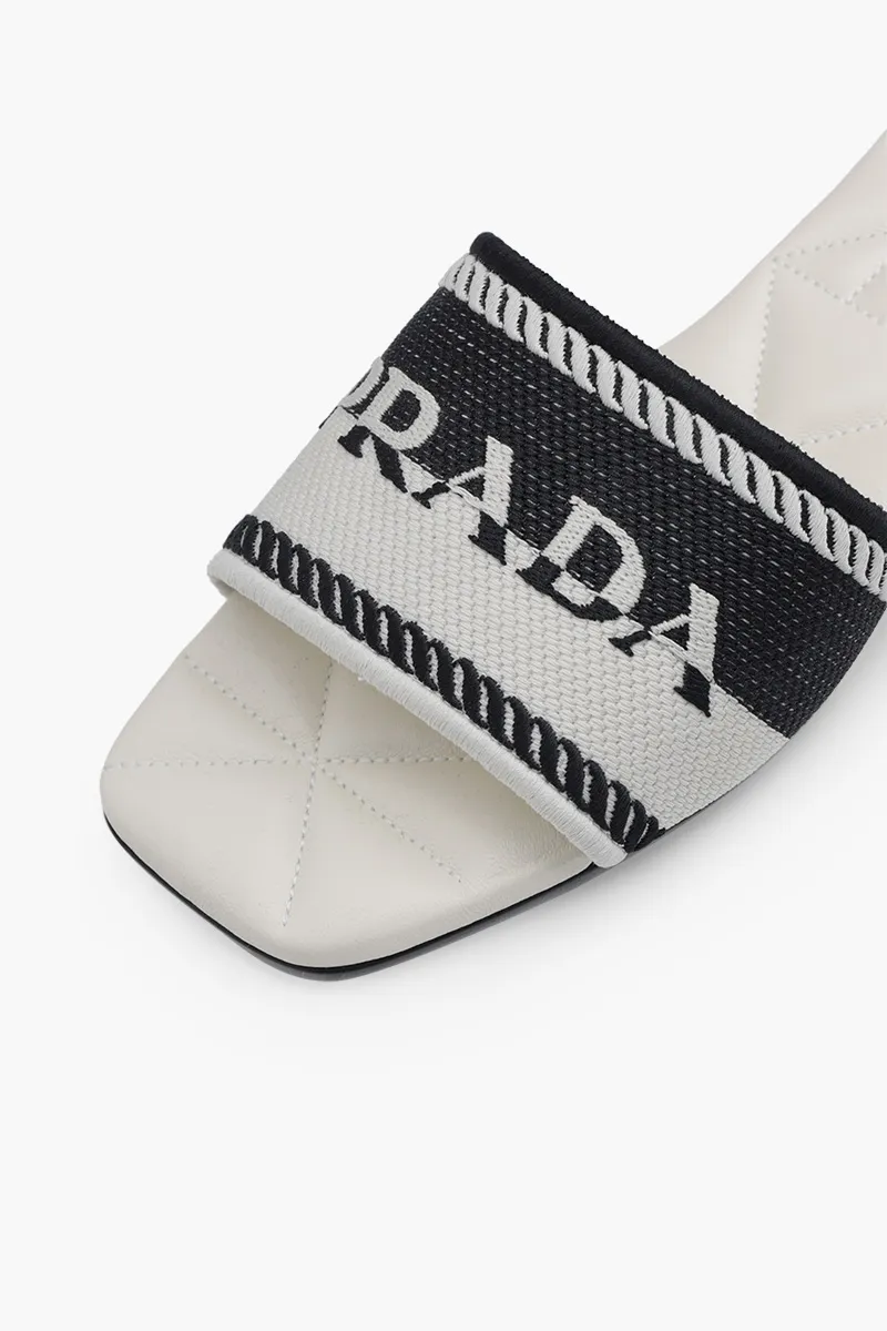 PRADA Women Embroidered Lettering Logo Slides in Black/Chalk White with Quilted Sole 4