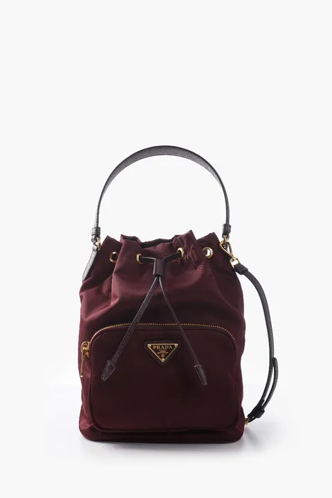 PRADA Duet Re-Nylon Enameled Triangle Logo Bucket Bag in Burgundy